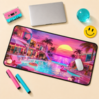 A large rectangular desk mat with a colorful retro-futuristic poolside sunset scene, styled on a beige surface with a laptop, mouse, markers, and decorative props.