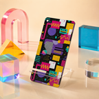 A smartphone case with a colorful 1980s geometric pattern featuring pink, purple, yellow, and blue shapes on a black background, displayed on a clear acrylic stand.